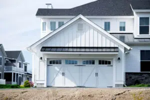 White coastal home exterior showing how coastal conditions affect exterior paint in Satellite Beach
