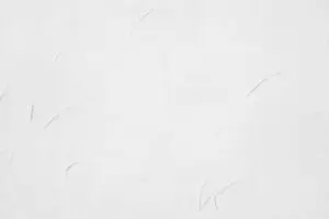 Faded and discolored interior paint on a white wall surface showing what causes interior paint to fade over time